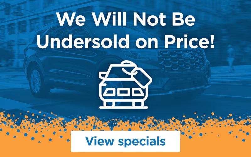 An SUV on a street with text We Will Not Be Undersold on Price! and a View specials button.